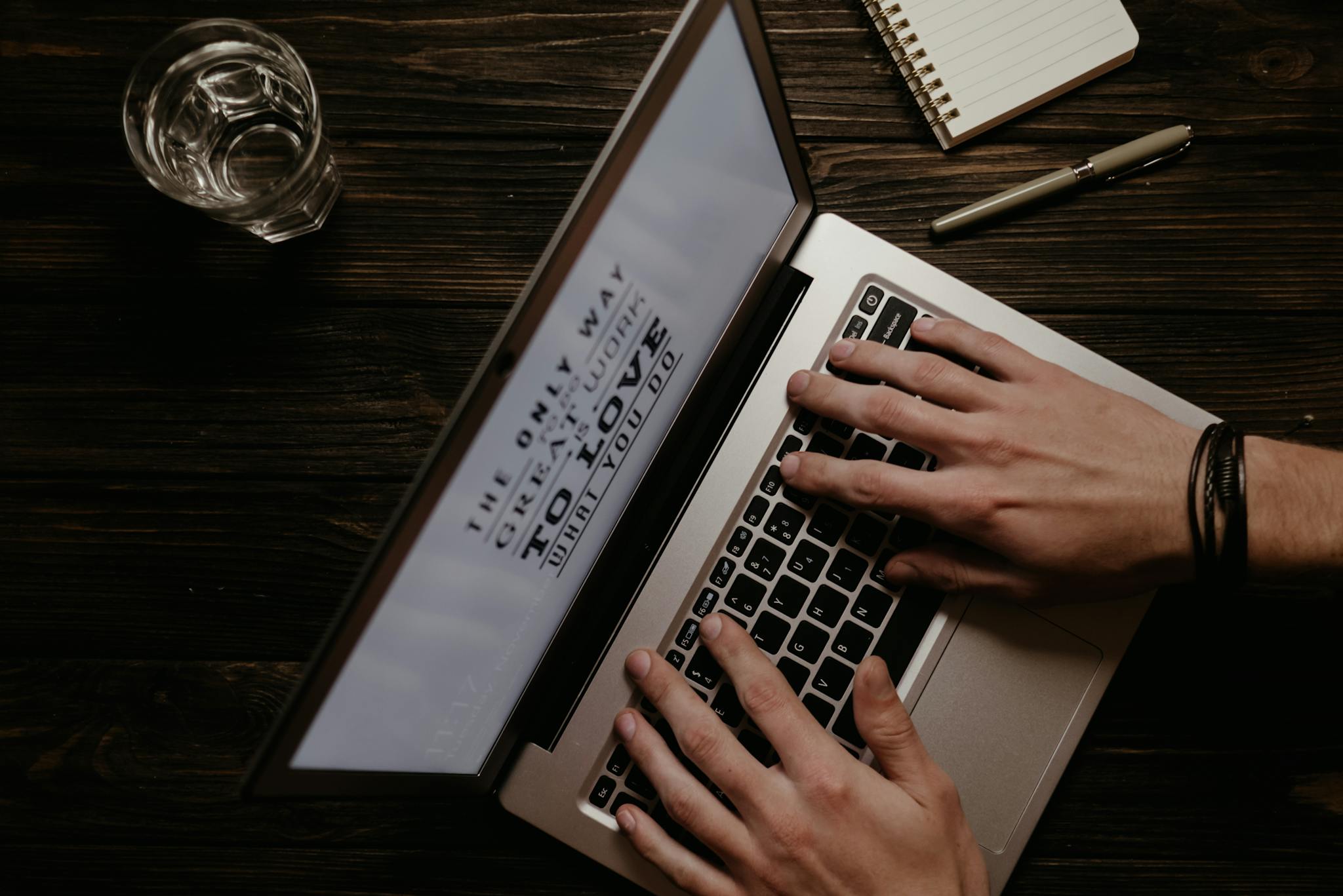 Hands On A Laptop With An Inspirational