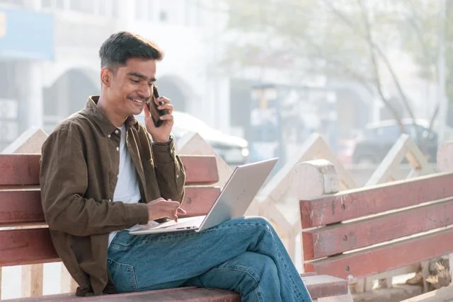 A man on a call with a laptop